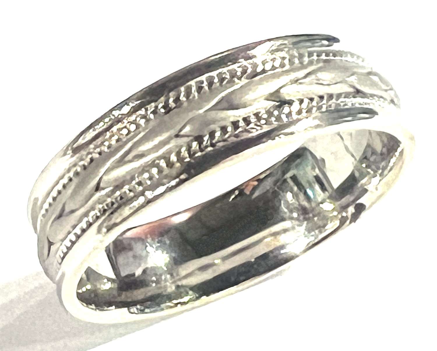 Two-tone white and yellow 14k gold Malo wedding band ring, 7mm wide, angle showing polished finish and smooth shank, approx. 5.95 grams