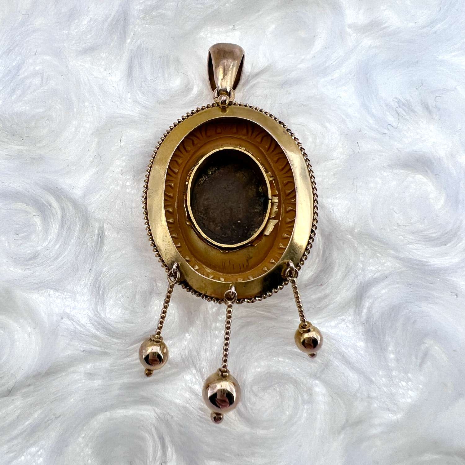 Side angle of 15kt yellow gold floral pendant showcasing depth and craftsmanship
