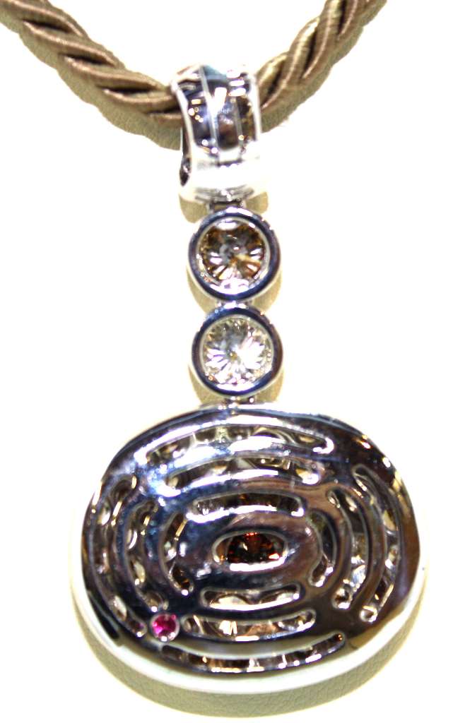 Side profile of 18kt white gold diamond pendant emphasizing enhancer bail and rope style nylon chain clasp