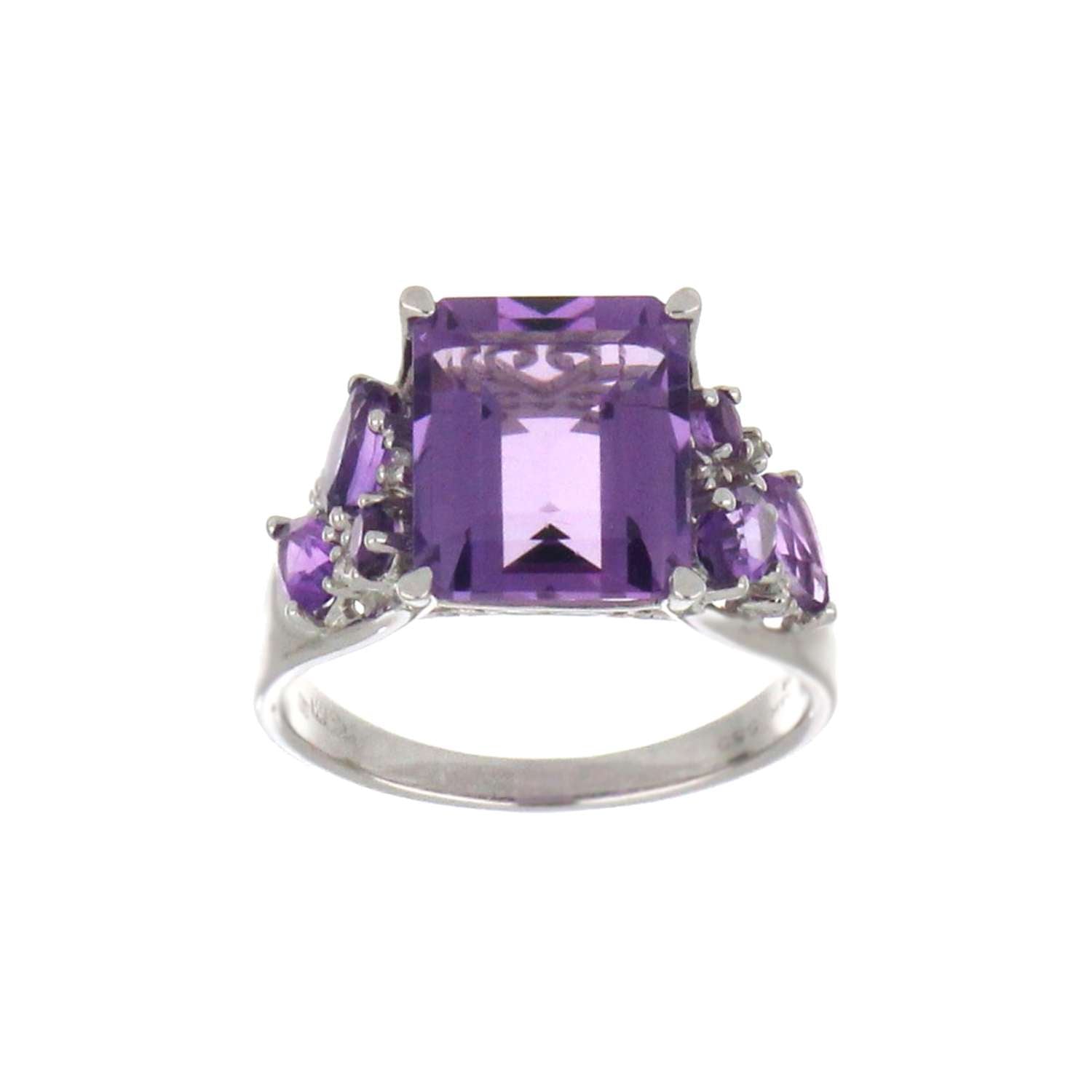 Close-up angle of 14kt white gold amethyst ring showing pear and oval shaped purple amethysts and round diamonds