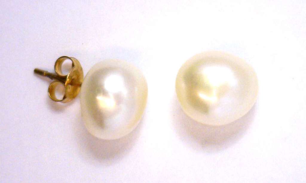 14kt yellow gold earrings featuring two luminous white freshwater pearls, side angle showing delicate setting