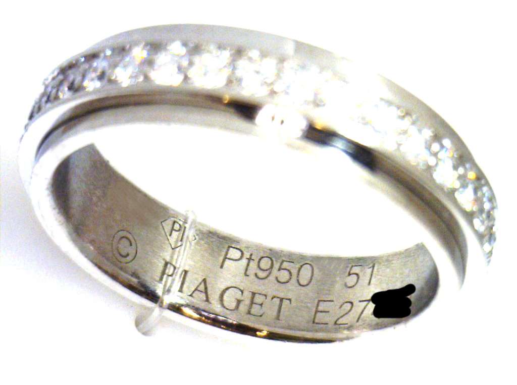 Top view of Piaget Possession diamond wedding band, 4.8mm wide platinum band with 0.53 cttw diamonds