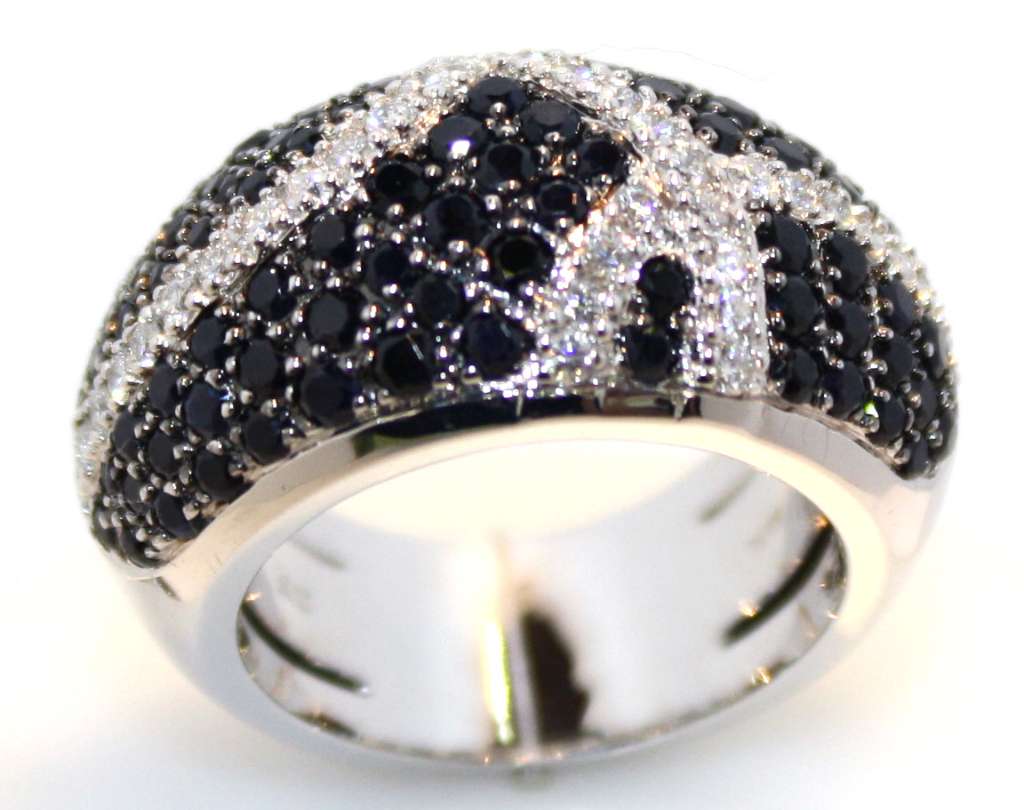 18kt white gold diamond dinner ring showing round brilliant cut diamonds and black sapphires, angled view highlighting stone setting