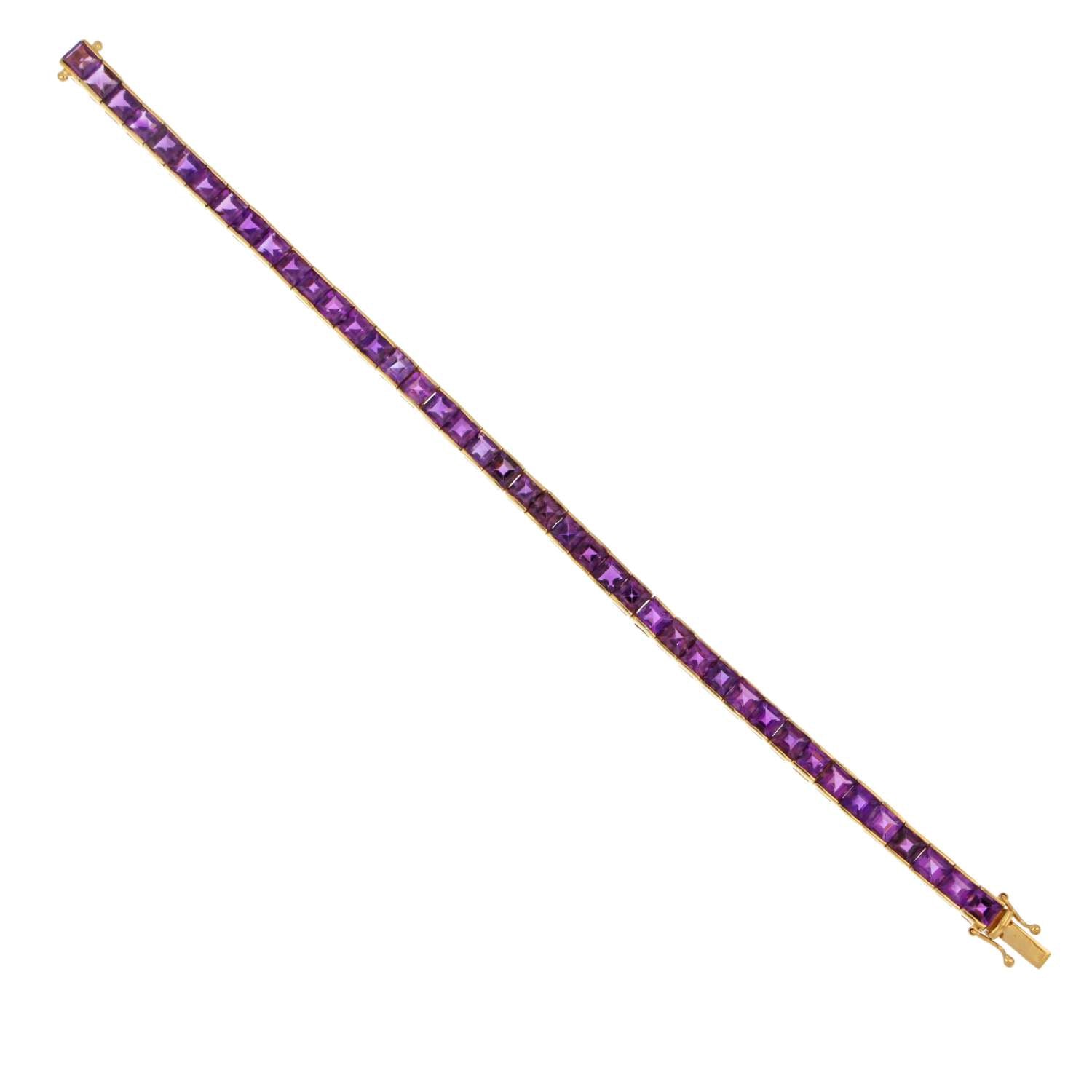 Full length of 14kt gold amethyst bracelet displaying lustrous yellow gold and vivid purple stones