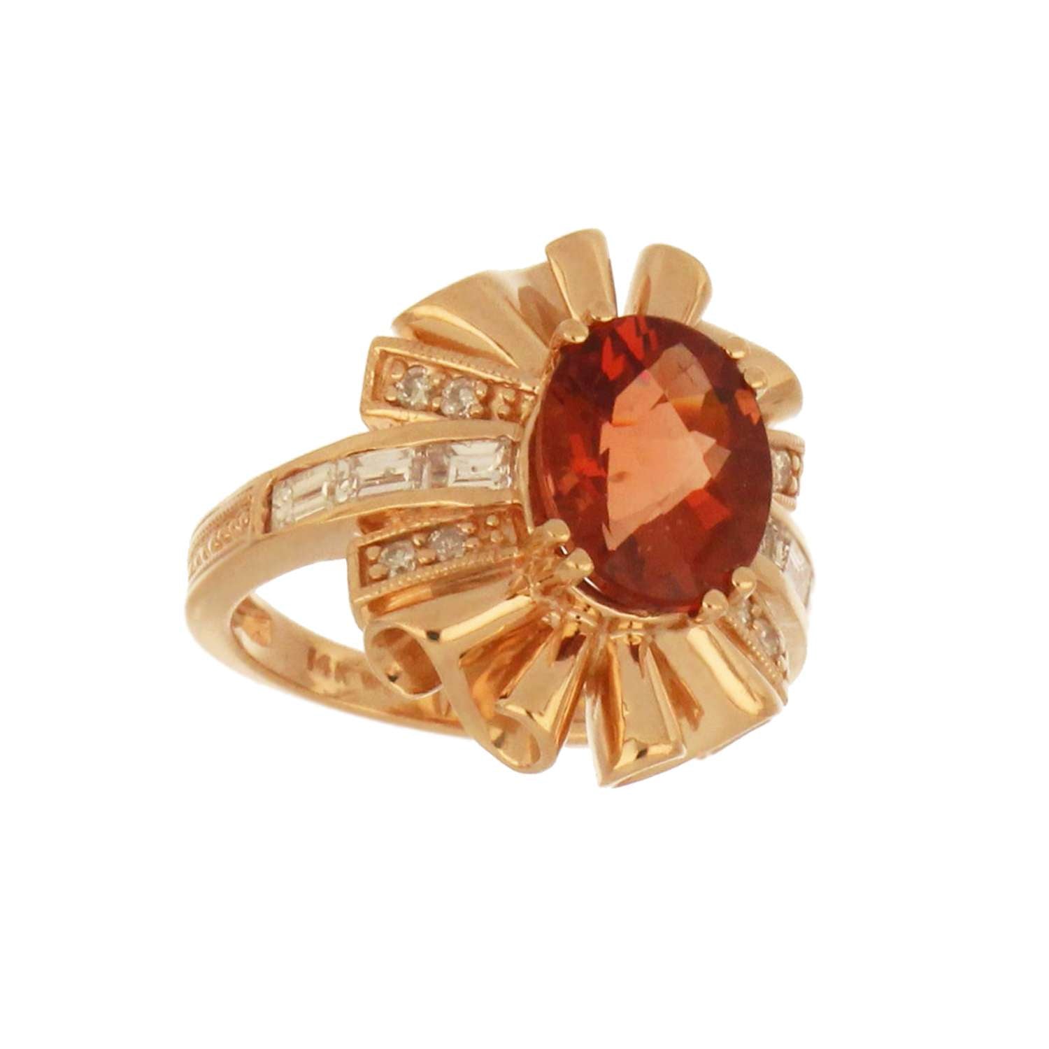 Ring resting on textured surface displaying rose gold band and glistening diamond arrangement around feldspar