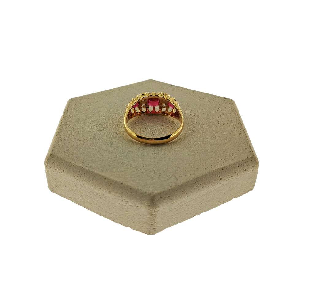 Detailed view of 18kt yellow gold ring band and vintage old mine diamonds with synthetic rubies