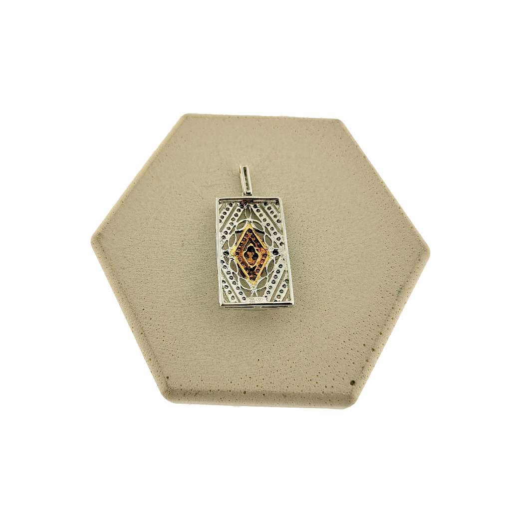 Close-up side view of 14kt white and yellow gold diamond pendant highlighting diamond setting and bi-color gold composition
