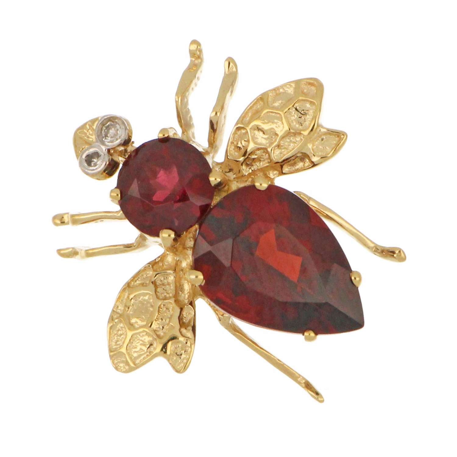 14kt yellow gold fly style brooch displaying pear shaped garnet and round garnet from top angle