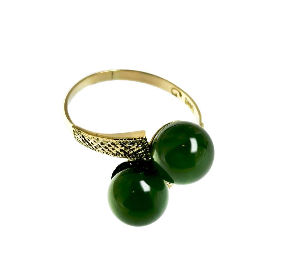 Side angle view of 10kt yellow gold BC jade ring highlighting the elegant setting and smooth contours of the size 6 band