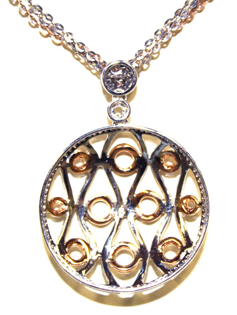 Full view of diamond pendant and matching cable link chain in 18kt white and rose gold