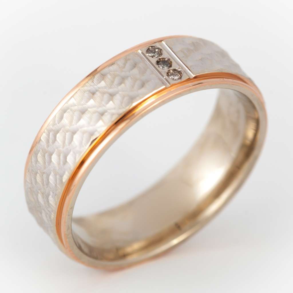 Side angle of elegant 10kt rose gold and white gold diamond band emphasizing the polished finish and delicate diamond settings