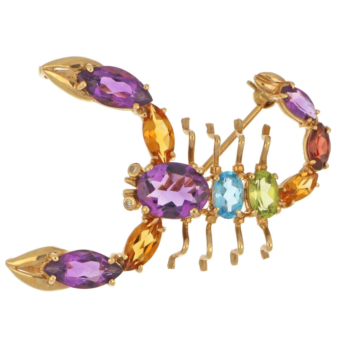 Close-up of scorpion motif brooch crafted in 14kt yellow gold featuring marquise and oval cut amethyst, citrine, blue topaz, garnet, and diamonds
