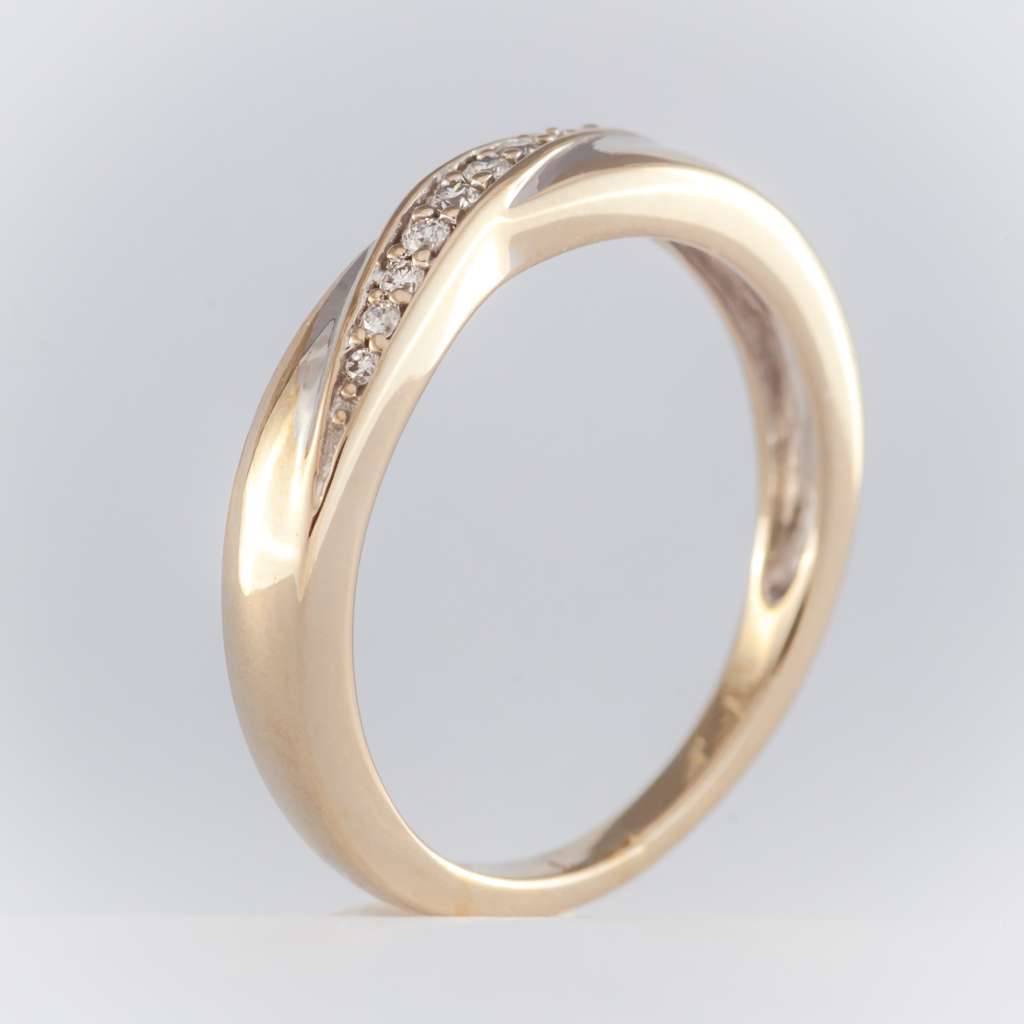 Close-up of 14kt white gold diamond band featuring 9 round brilliant cut diamonds in a classic setting