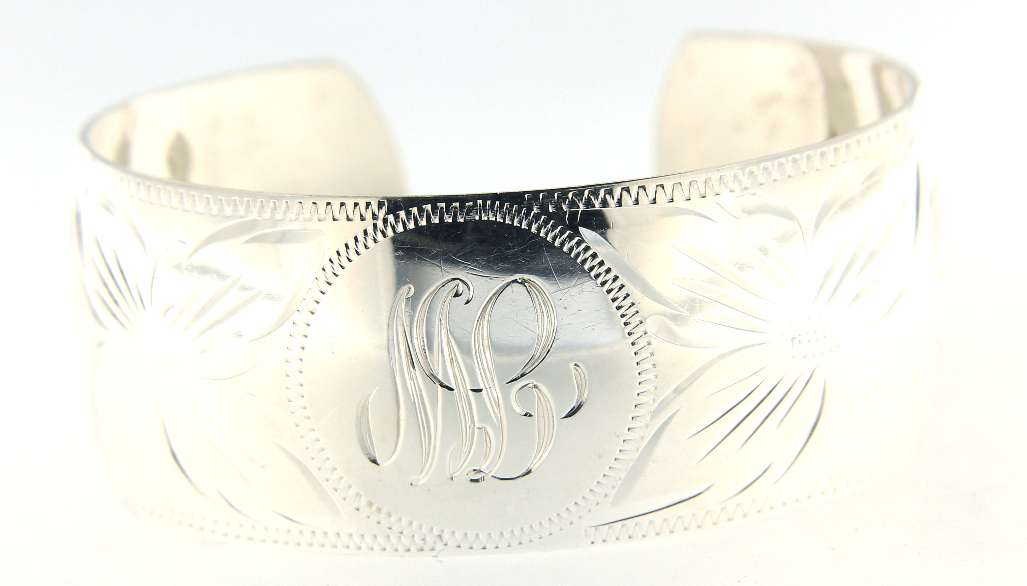 Sterling silver open-end bangle bracelet smooth polished finish close-up angle