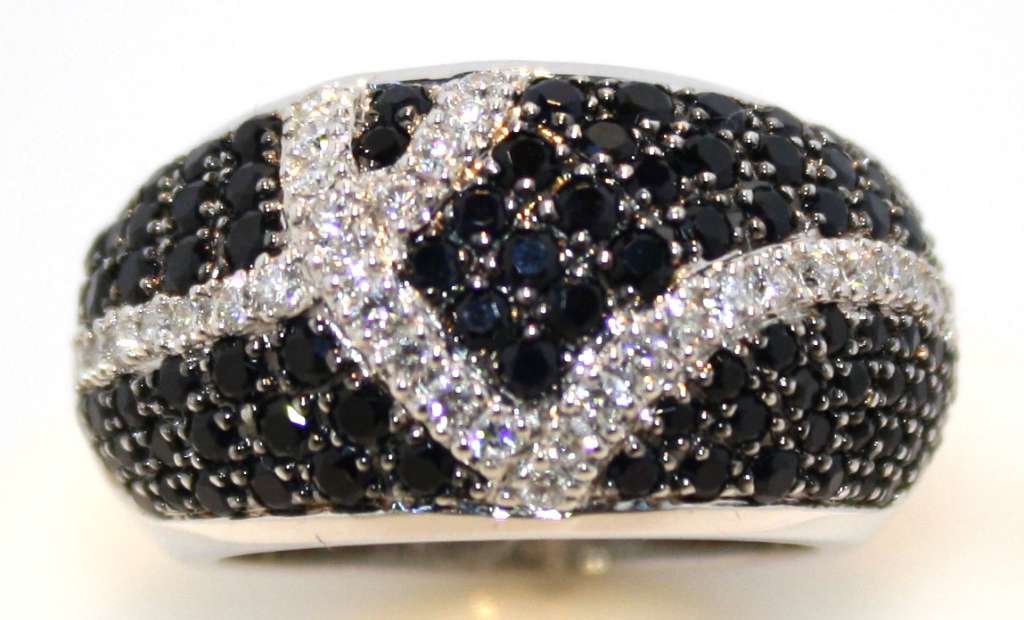 Side profile of 18kt white gold diamond dinner ring showcasing craftsmanship and total weight of 17.86 grams