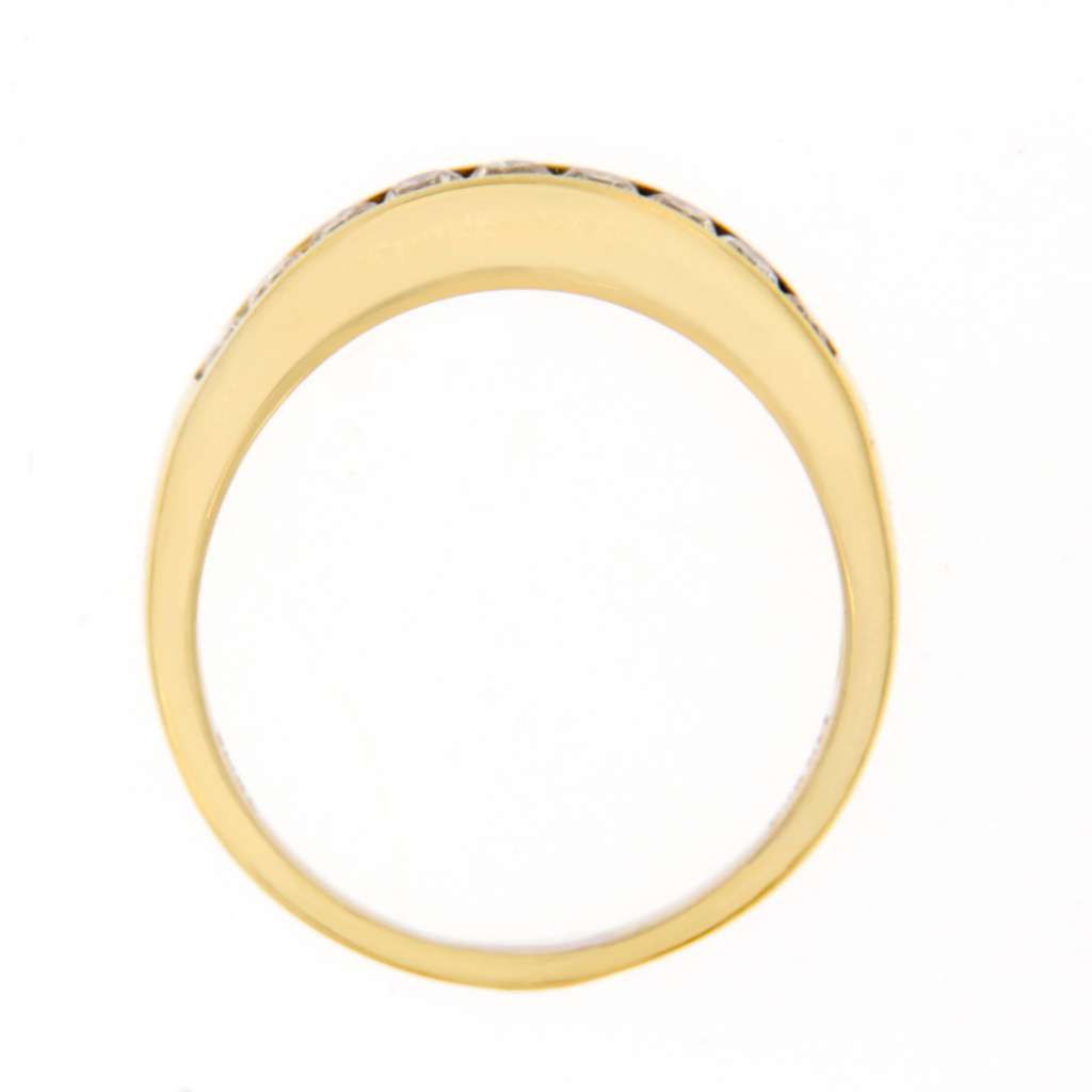 Vintage style ladies' diamond band in yellow gold, detailed shot focusing on craftsmanship and diamond alignment.