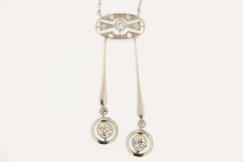 Side angle of vintage 14kt white gold diamond necklace showcasing intricate platinum chain links