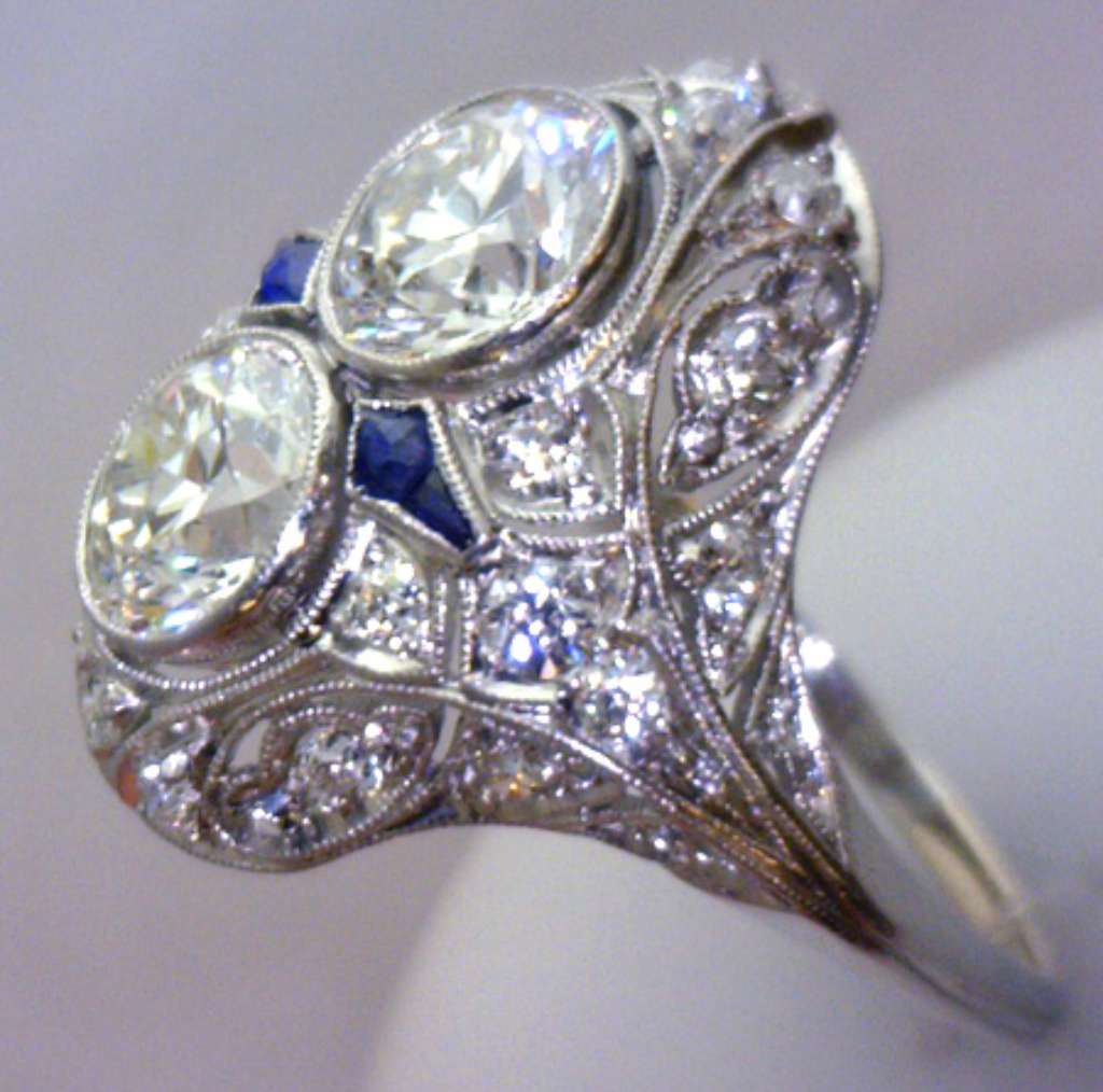 Top-down image illustrating the balance of two main diamonds and surrounding smaller diamonds with vivid blue sapphires