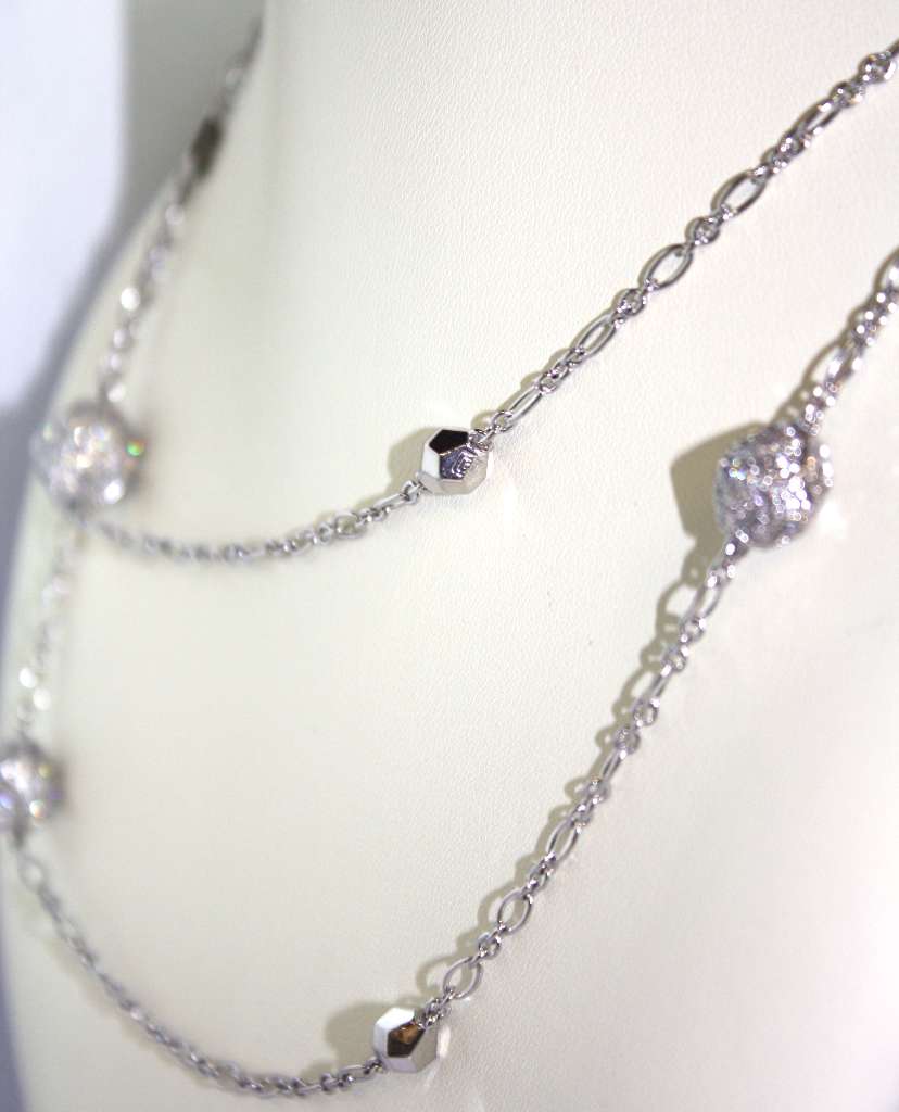 Side angle view of 18kt white gold diamond necklace showing diamond clarity and length