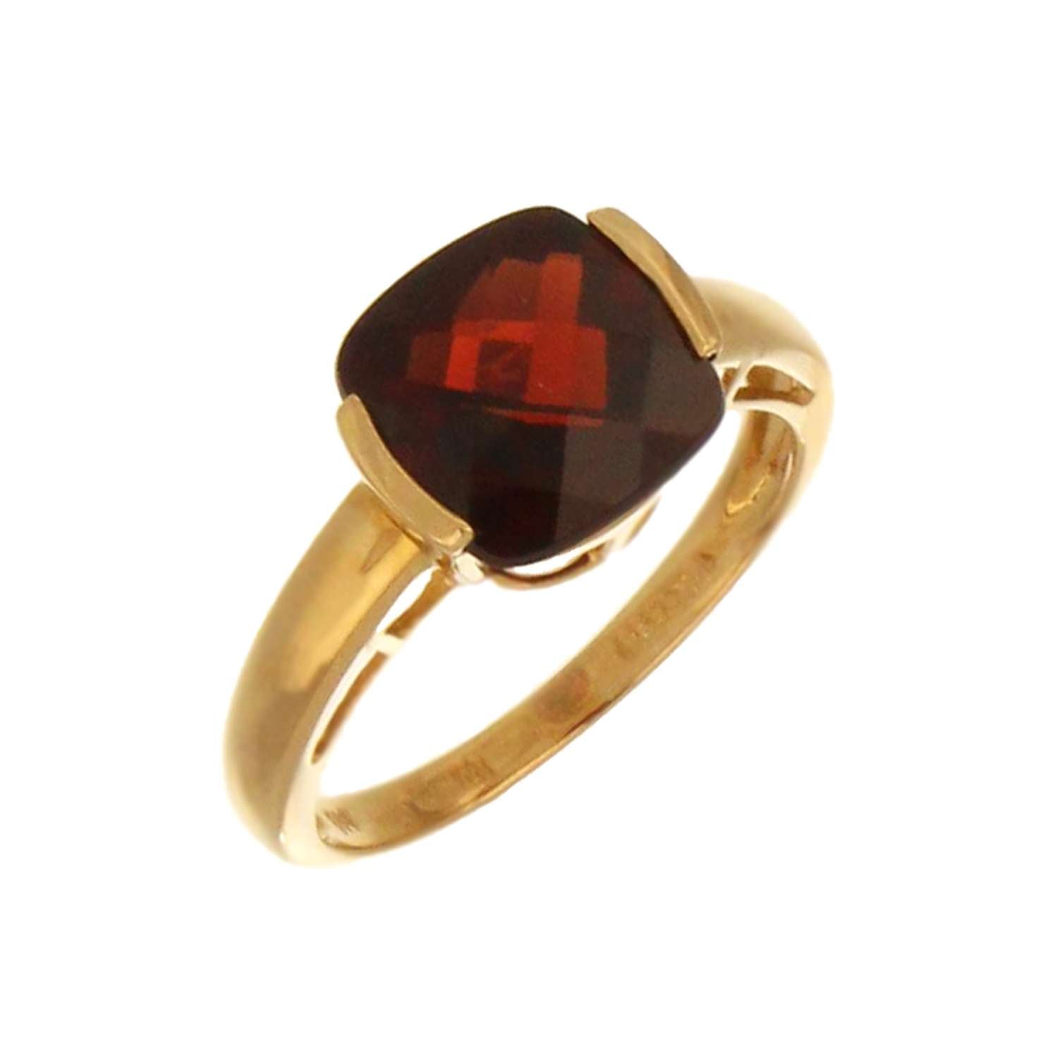 Close-up of 14kt yellow gold garnet ring showing channel setting and rich garnet stone