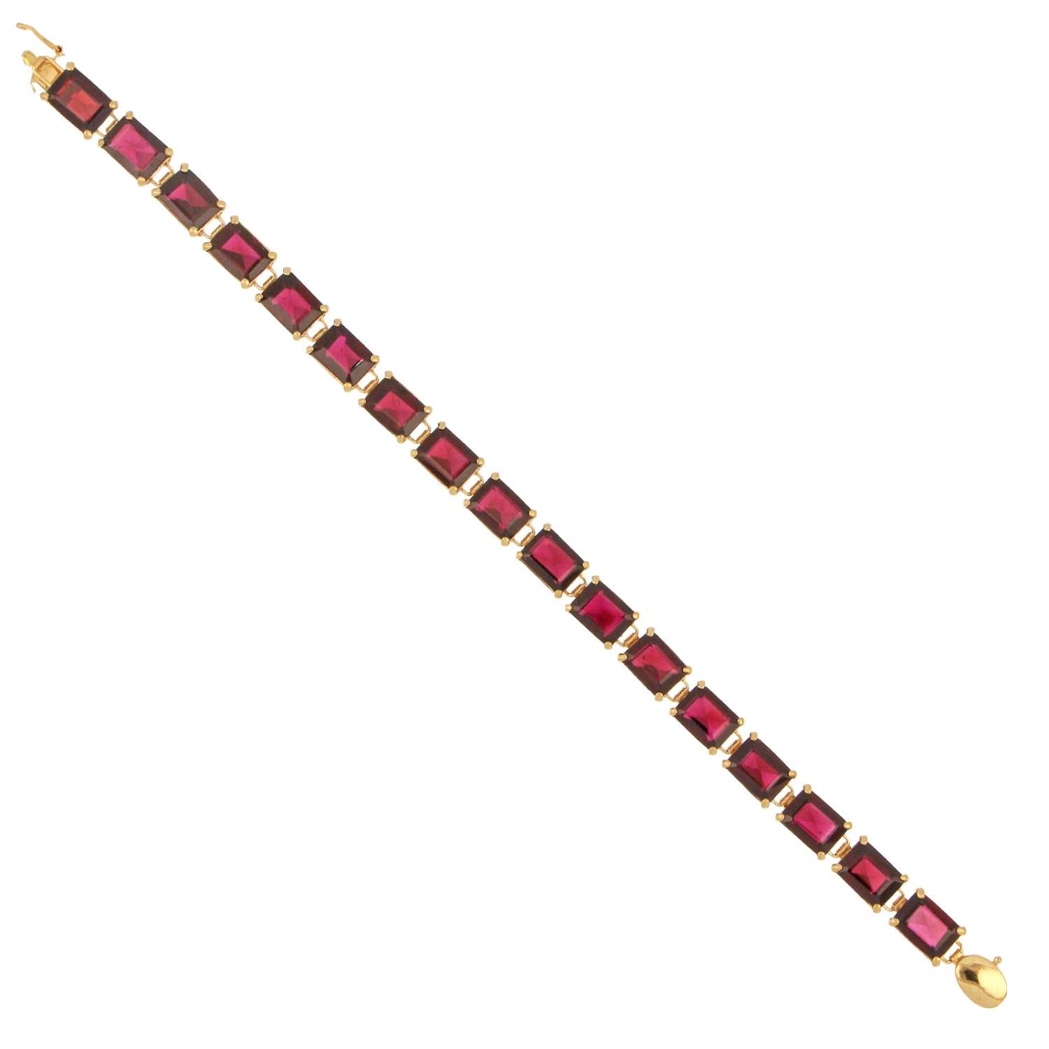 Full length view of authentic 14kt yellow gold garnet bracelet with baguette garnets, polished finish, vintage design
