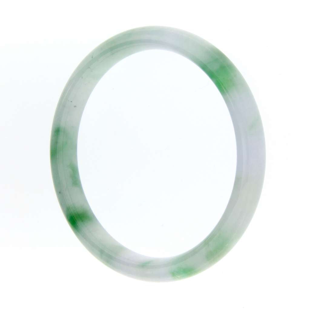Close-up detail of Burmese natural jadeite jade bangle's mottled medium dark green patches and smooth finish