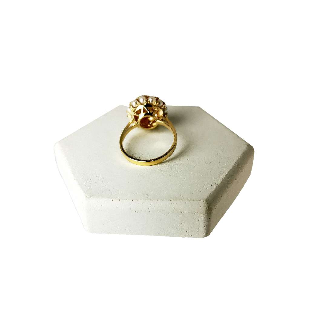 Close-up of 10kt yellow gold pearl ring highlighting lustrous white seed pearls and polished yellow gold