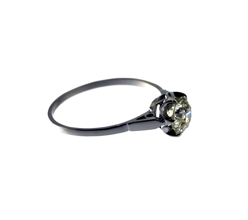 Side angle view of 14kt white gold antique ring displaying light champagne color diamond and band detail