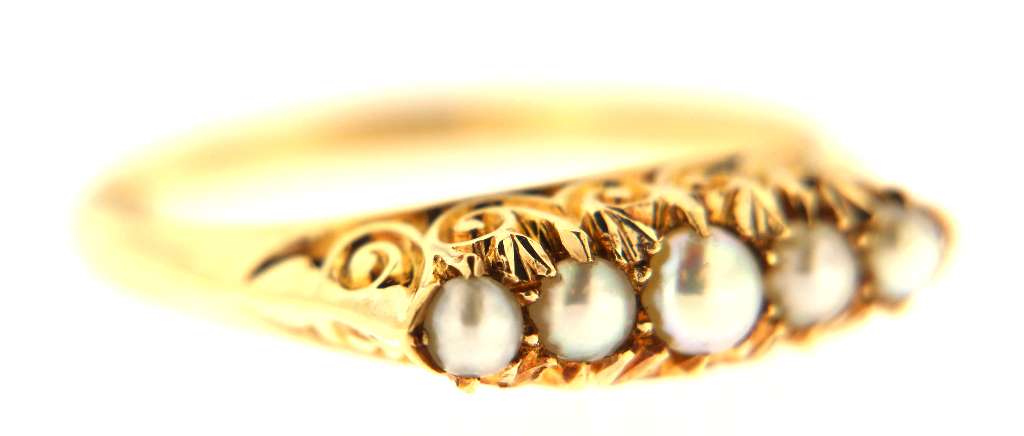 Detailed shot highlighting lustrous white seed pearls set on 14kt yellow gold ring by J&M Coin & Jewellery