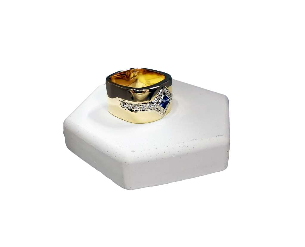 Side angle of yellow gold sapphire and diamond band showing thickness and design details