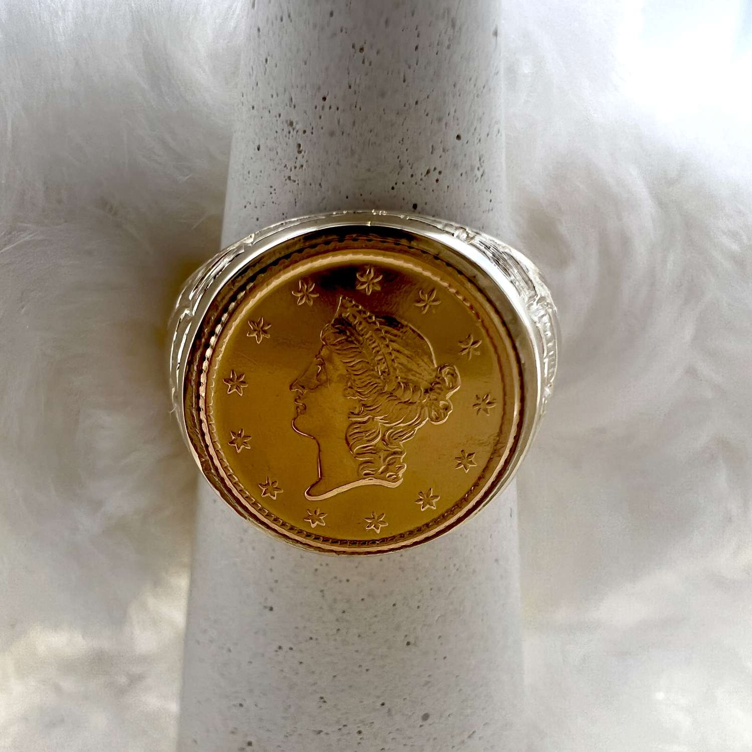 14kt yellow gold coin ring showing american $1 gold coin bezel setting, side angle, polished finish
