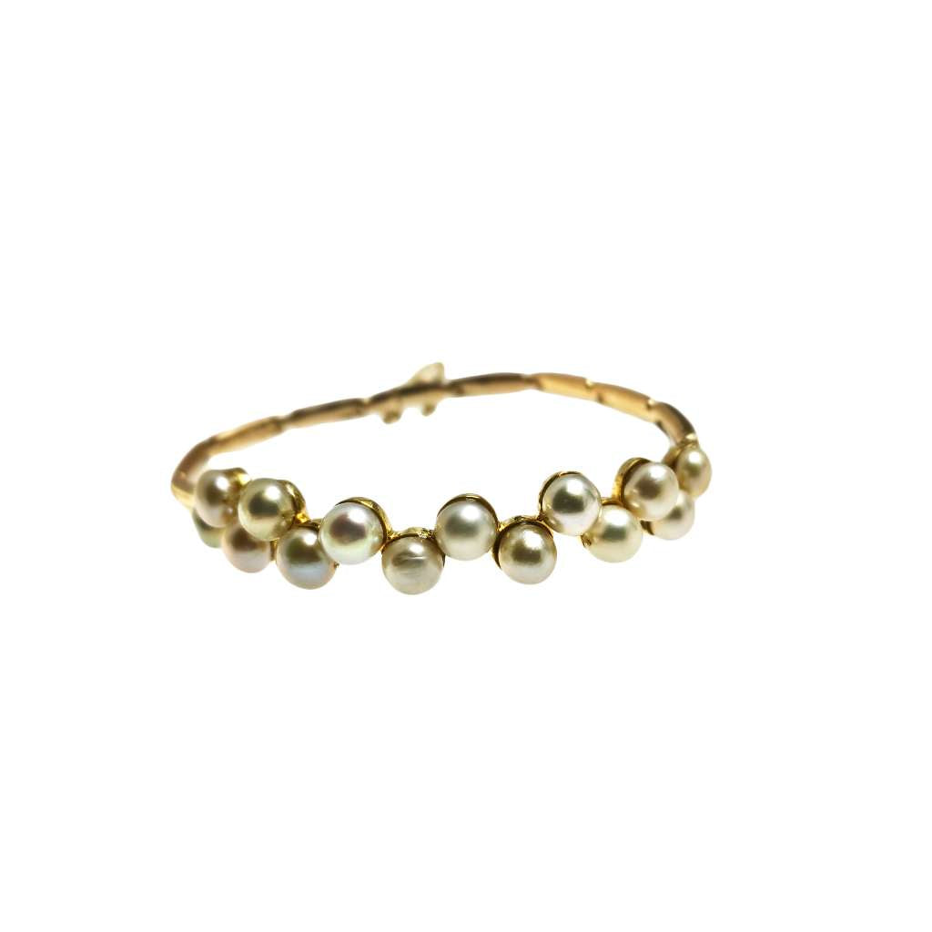 15kt yellow gold pearl bracelet showing 14 round freshwater pearls and hollow bar links, side angle view