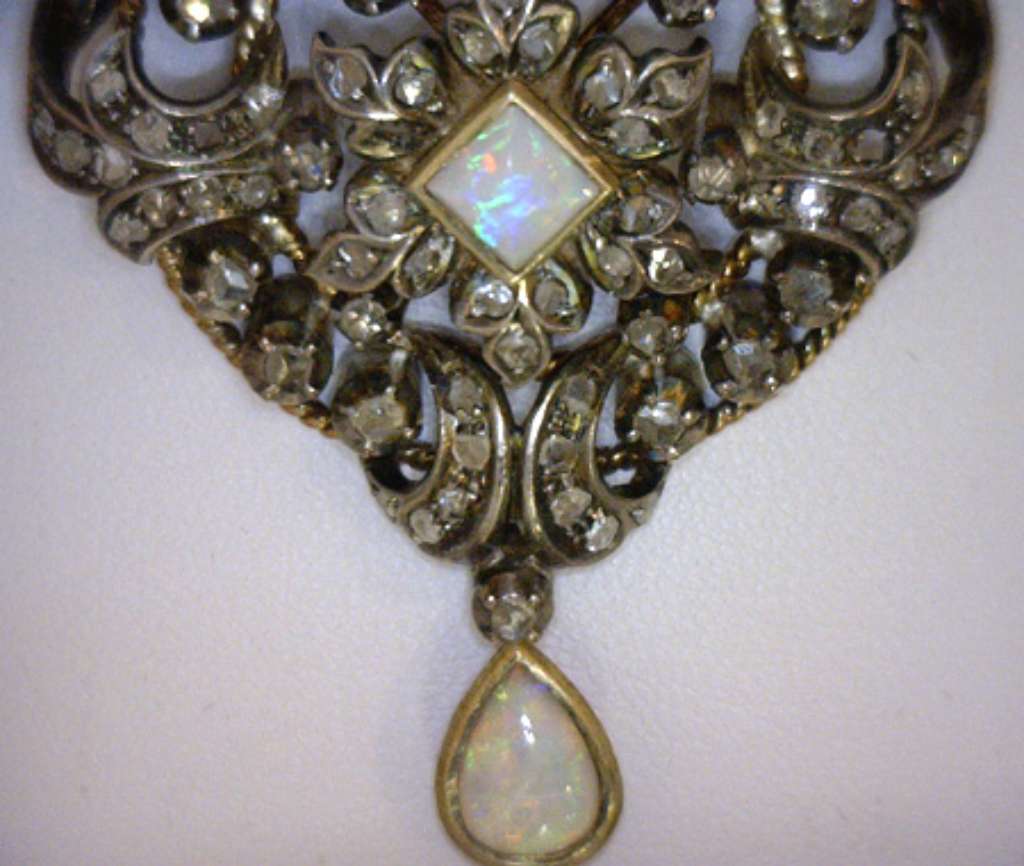 Full front view of antique opal and diamond brooch in 18kt yellow and white gold with silver accents