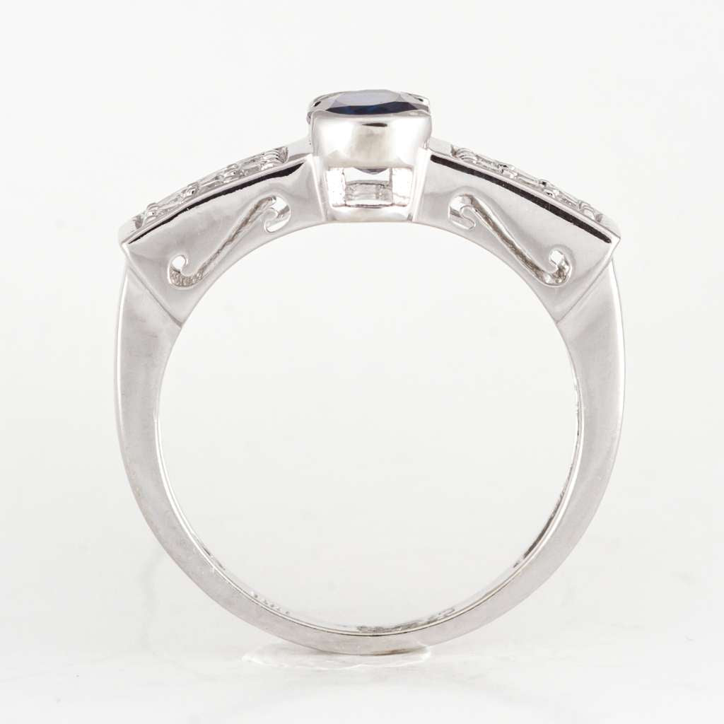 Side profile of 14kt white gold ring highlighting diamond arrangement and polished finish