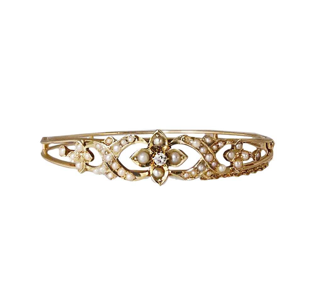 Antique 14kt yellow gold seed pearl bangle with central old mine cut diamond, top view highlighting pearl settings