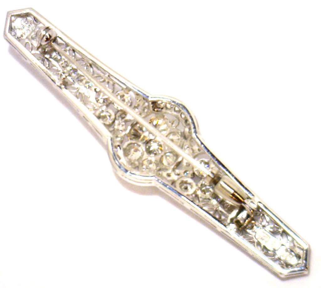 Back view of 14kt white gold diamond brooch revealing craftsmanship and secure clasp mechanism