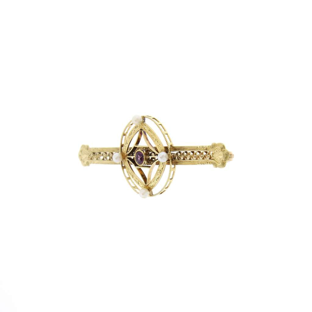 Back view displaying 10kt yellow gold pin backing of amethyst and pearl brooch