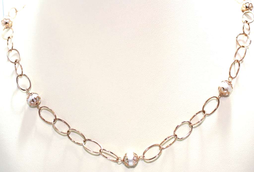 14kt rose gold pearl necklace, close-up of 8 white freshwater pearls, showing lustrous smooth surface and delicate rose gold chain