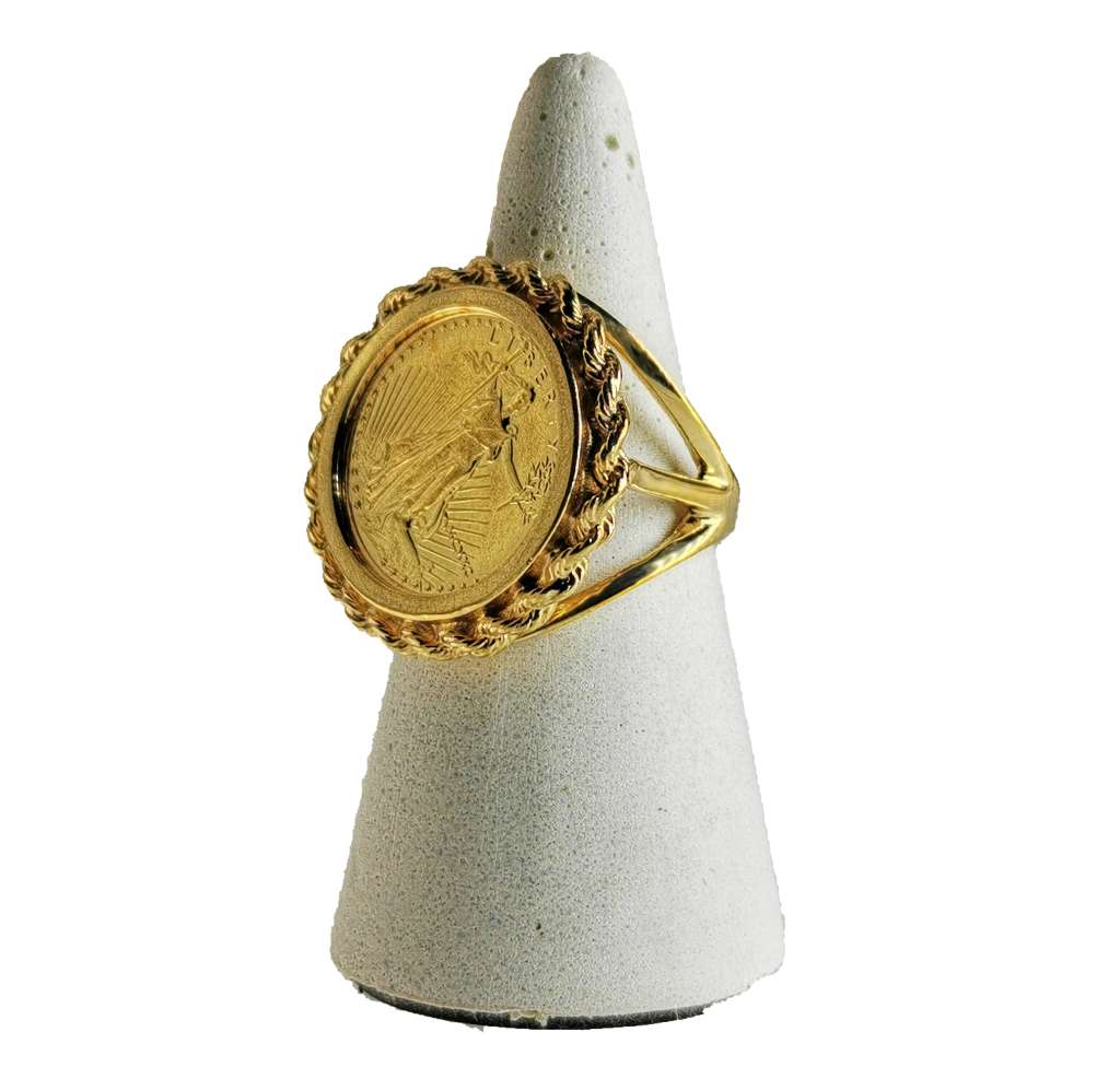 Side angle of yellow gold coin ring showing textured rope bezel and polished band, ring size 6.25