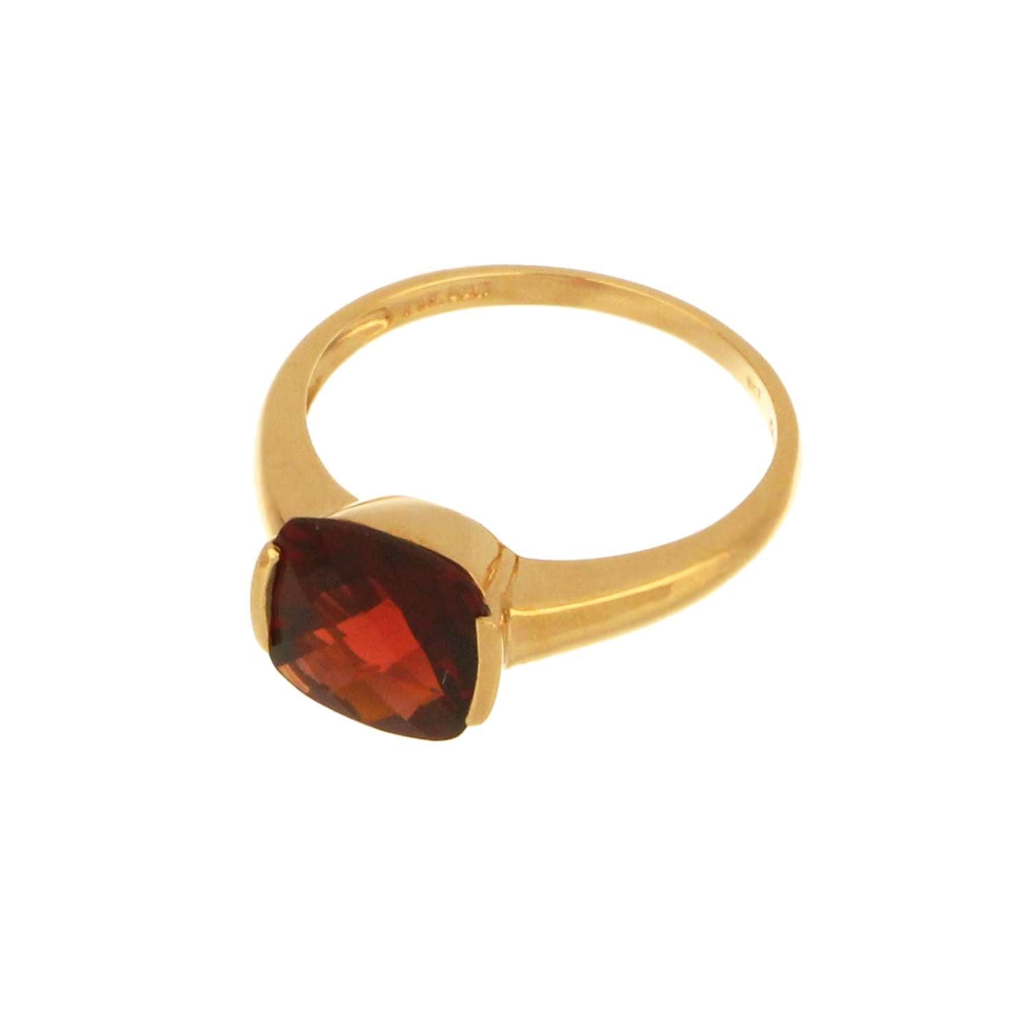 Side profile of 14kt yellow gold garnet ring highlighting channel setting and band thickness