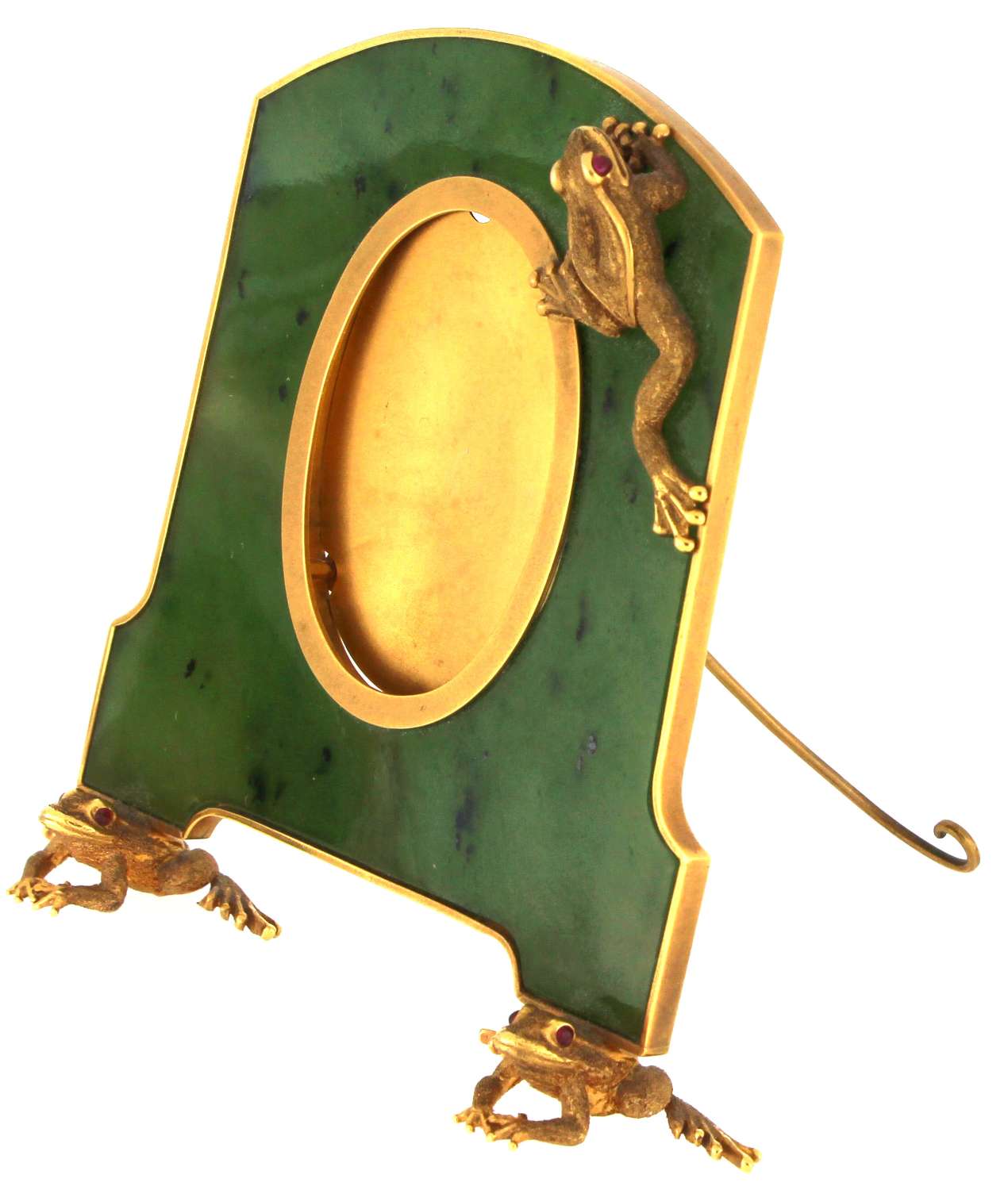 Close-up of frog motif on The Art of Zadora frame highlighting detailed cabochon ruby eyes set in yellow gold