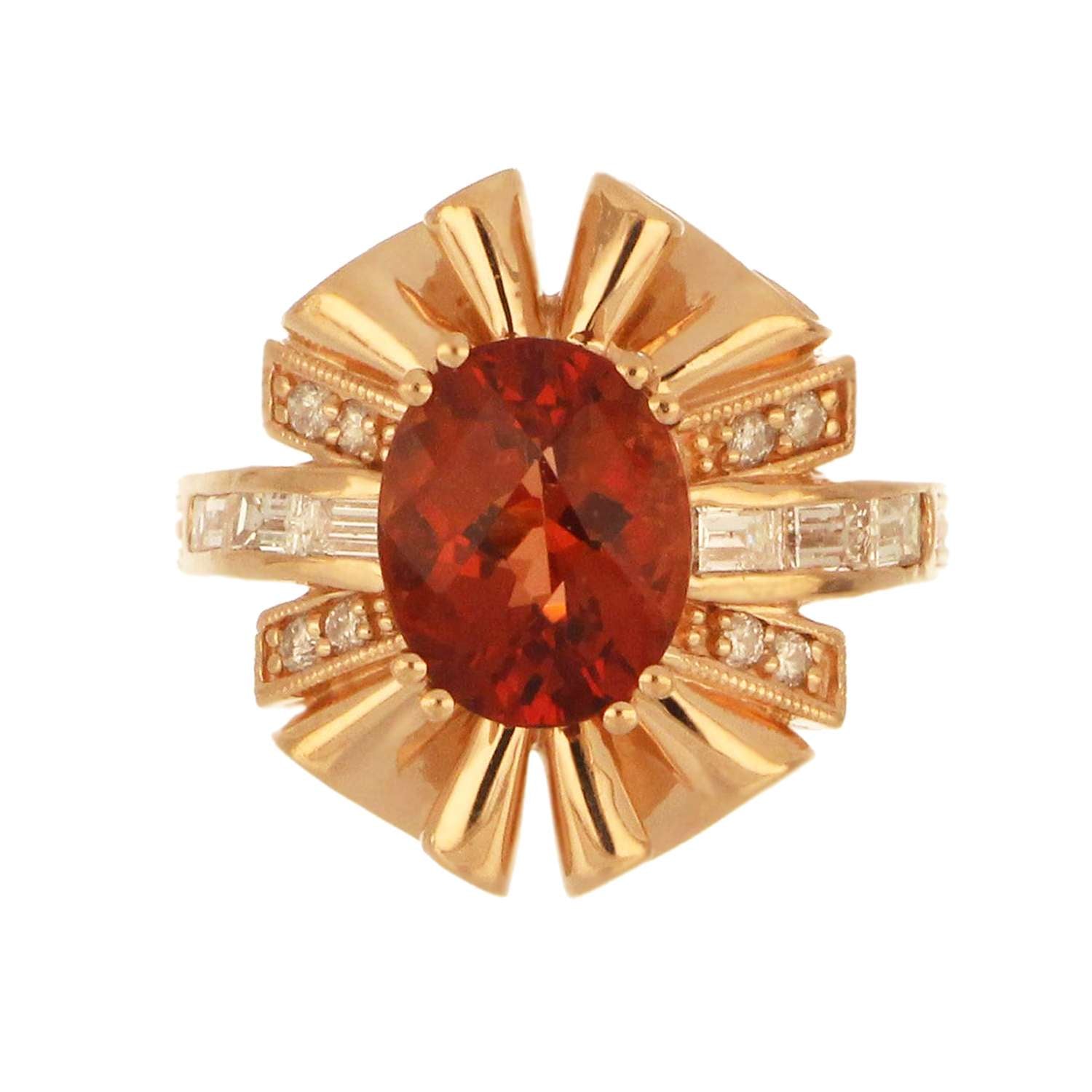14kt rose gold ring with oval chess cut andesine feldspar, surrounded by full cut and baguette diamonds, showcased from top angle