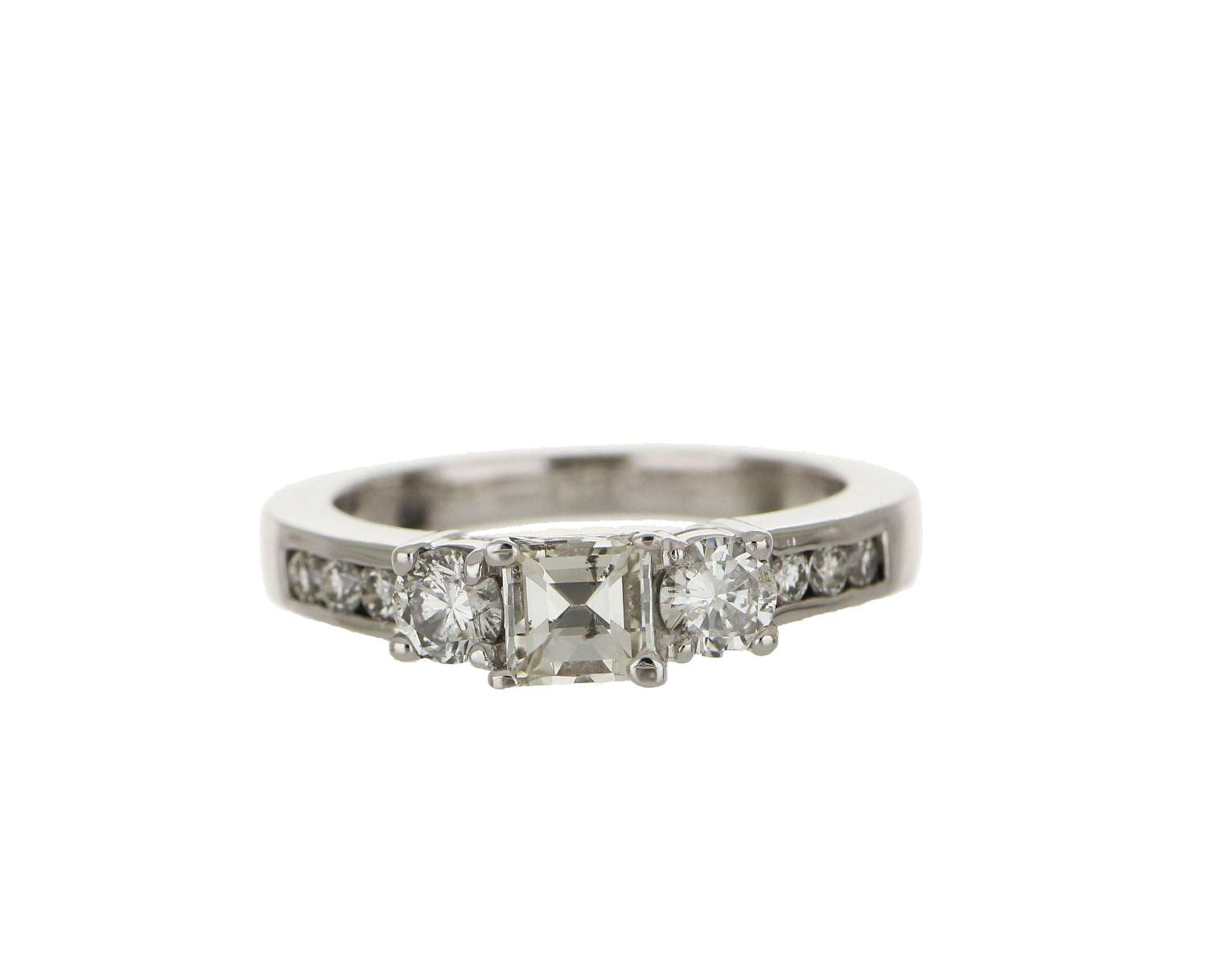 Close-up of 14kt white gold engagement ring showcasing round brilliant cut diamonds and full cut accent stones