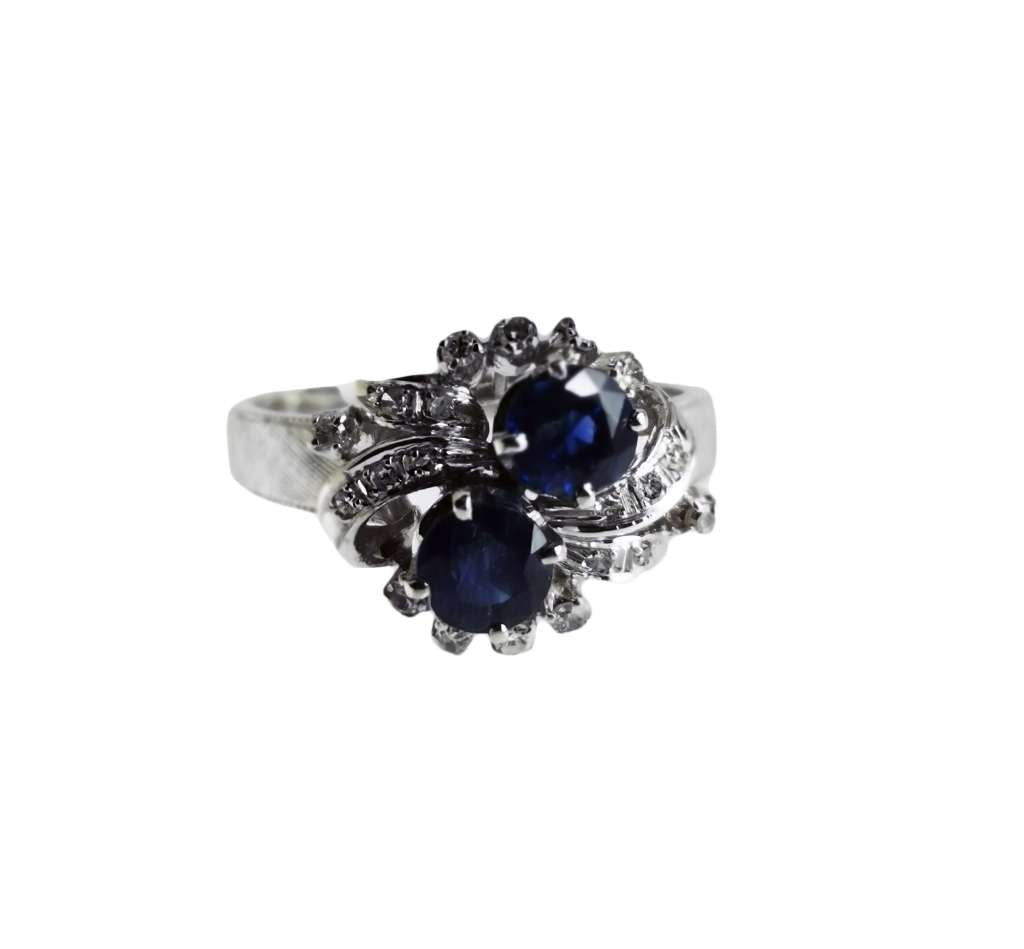 40% silver blue sapphire and diamond ring, top angle showing two round blue sapphires and surrounding round diamonds