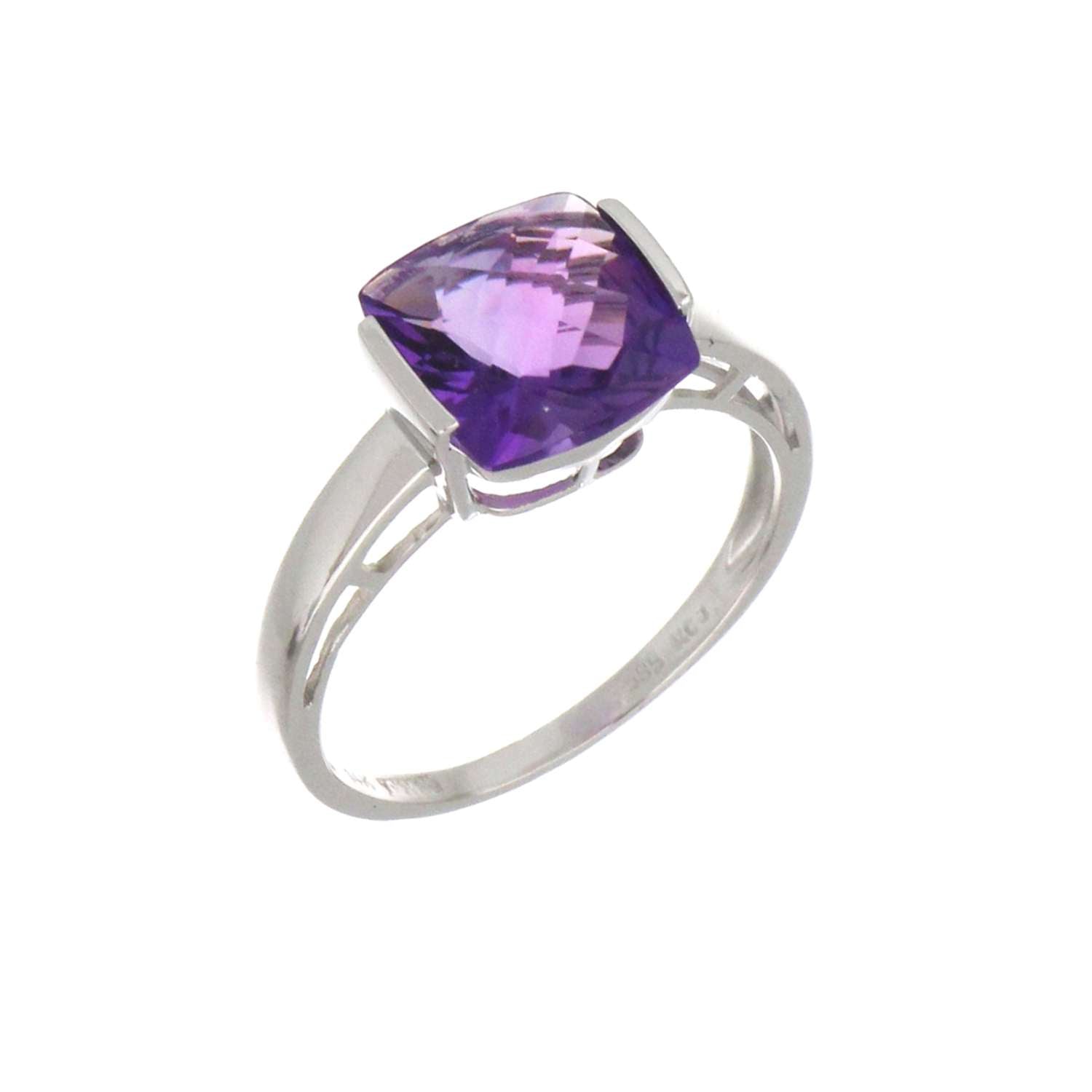 Close-up side angle of 14kt white gold amethyst ring highlighting channel setting and purple amethyst