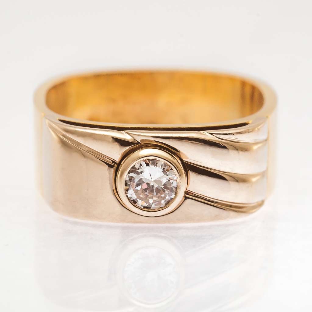 Close-up view of 14kt yellow gold diamond ring showing round 0.30ct diamond and band detail
