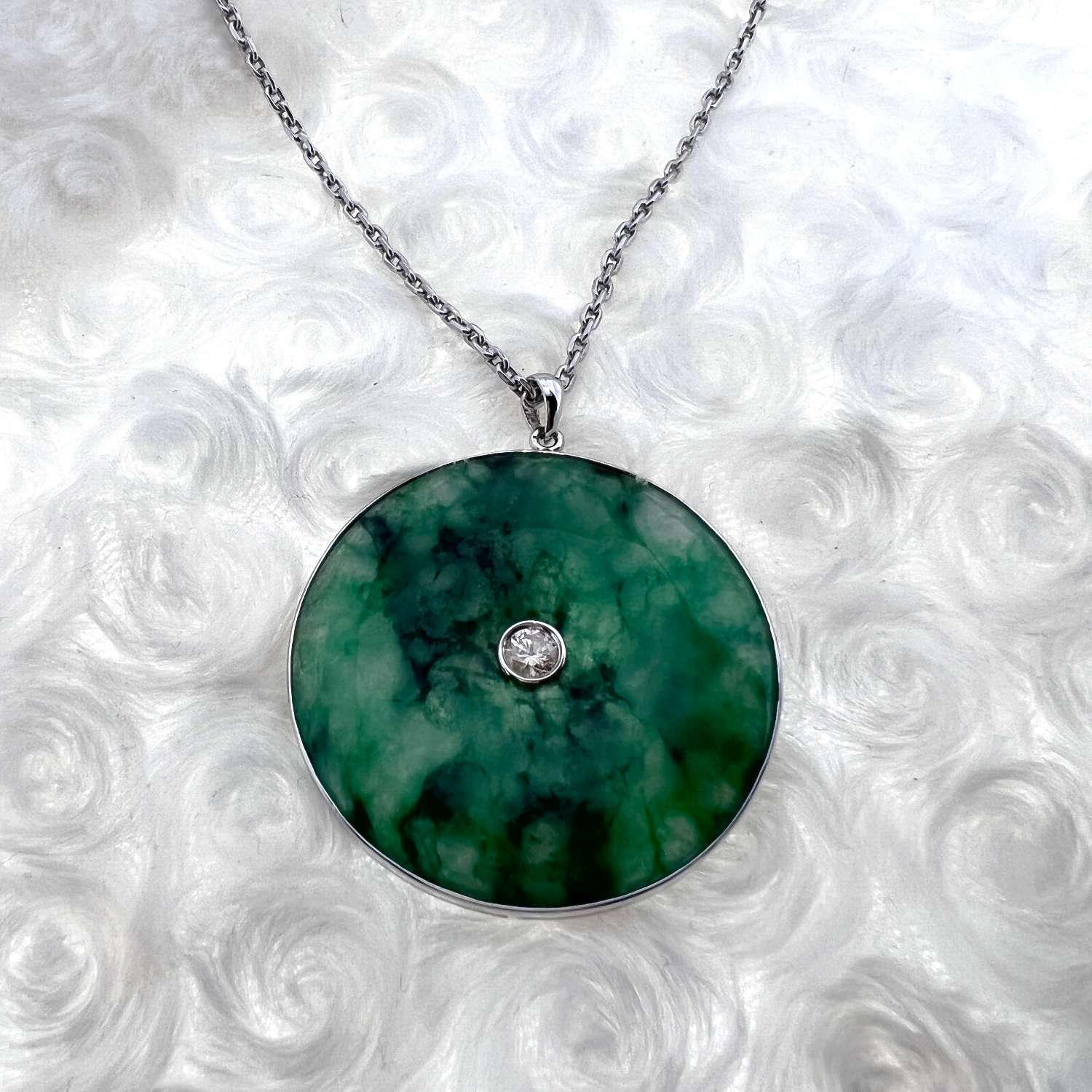 Full view of 18kt white gold jadeite pendant on 24-inch cable link chain, emphasizing elegant design and craftsmanship