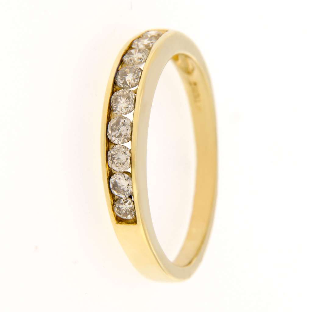 Side profile of collectible 14kt yellow gold ring featuring channel-set round brilliant diamonds weighing 0.45cttw, total ring weight 3 grams.