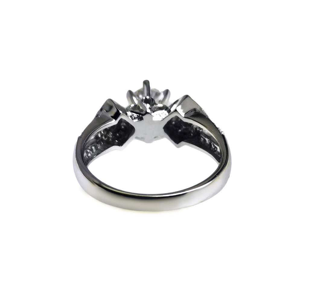 Close-up of 0.61ct princess cut diamond on 14kt white gold ring, highlighting VVS2 clarity and F color