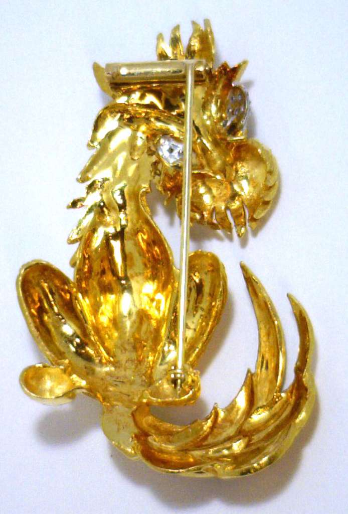 Macro image capturing the brilliance of the single cut diamonds on the stylized dog brooch